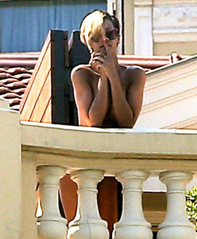 Rihanna - tanned and naked in balcony